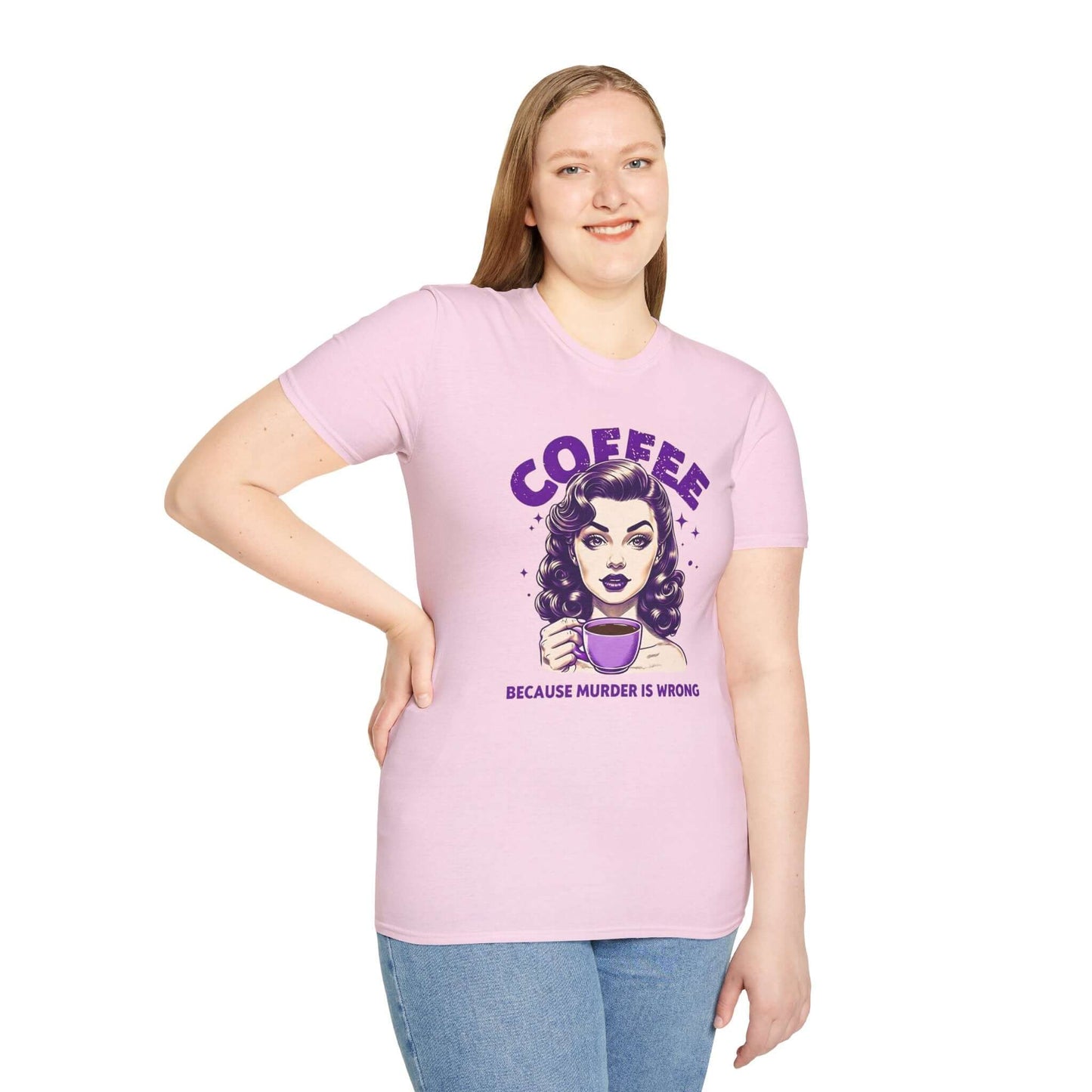 Smiling woman wearing a pink unisex t-shirt with a retro ‘Coffee - Because Murder Is Wrong’ design in purple, featuring a vintage-style woman holding a coffee cup.
