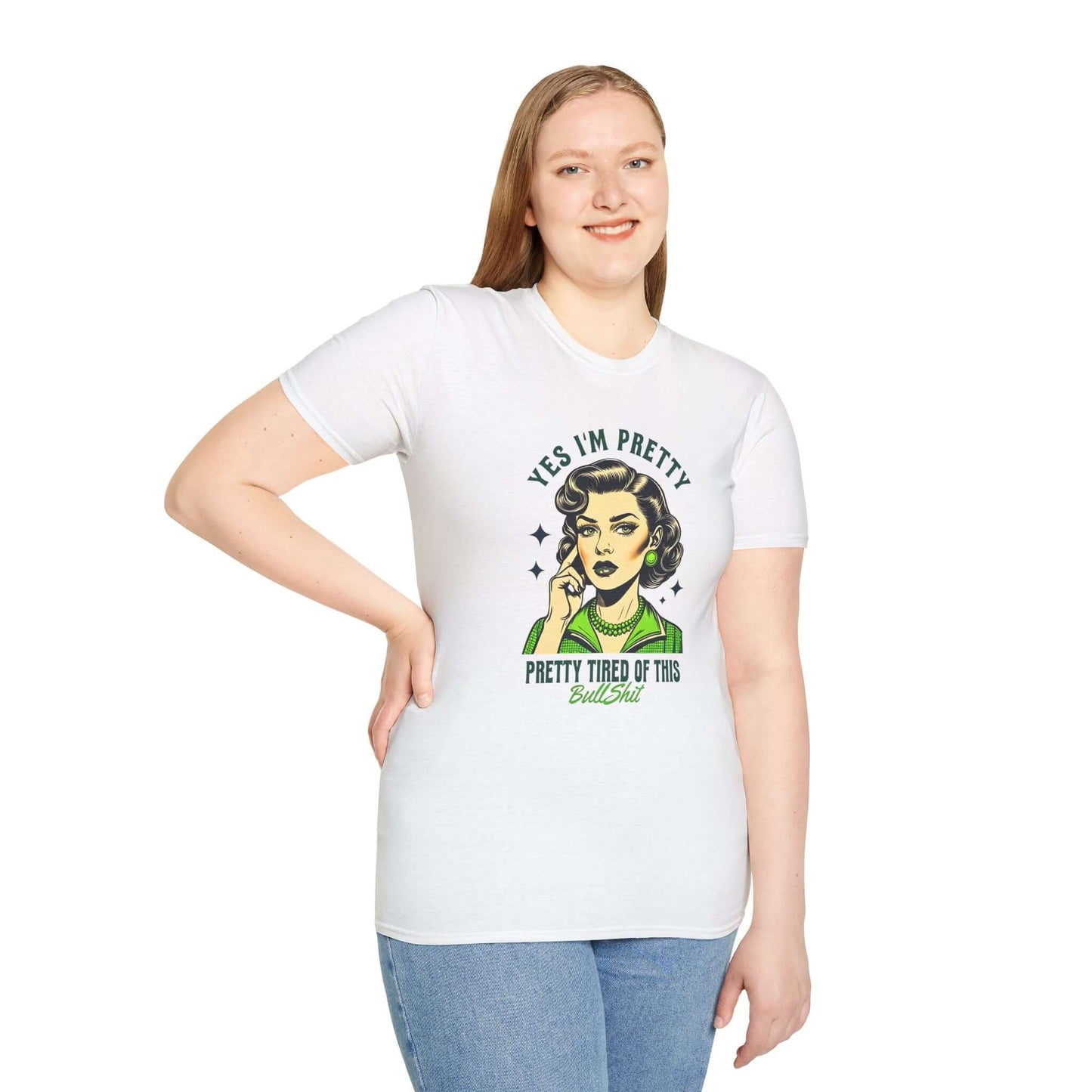 Smiling girl wearing a white unisex t-shirt featuring a retro-style design with the text ‘Yes, I’m Pretty Tired of This Bullsh*t’ in green.