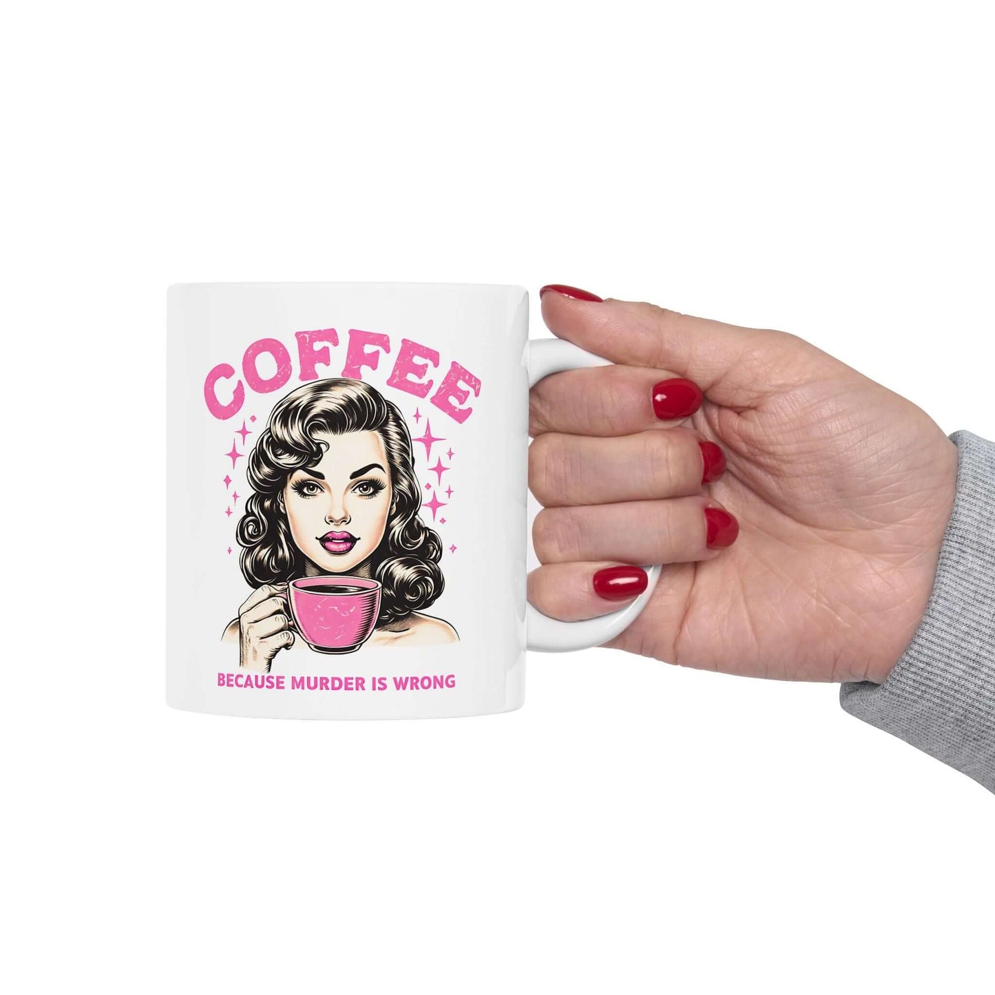 White ceramic mug featuring a retro design with ‘Coffee - Because Murder Is Wrong’ text in pink and an illustrated vintage-style woman holding a coffee cup.