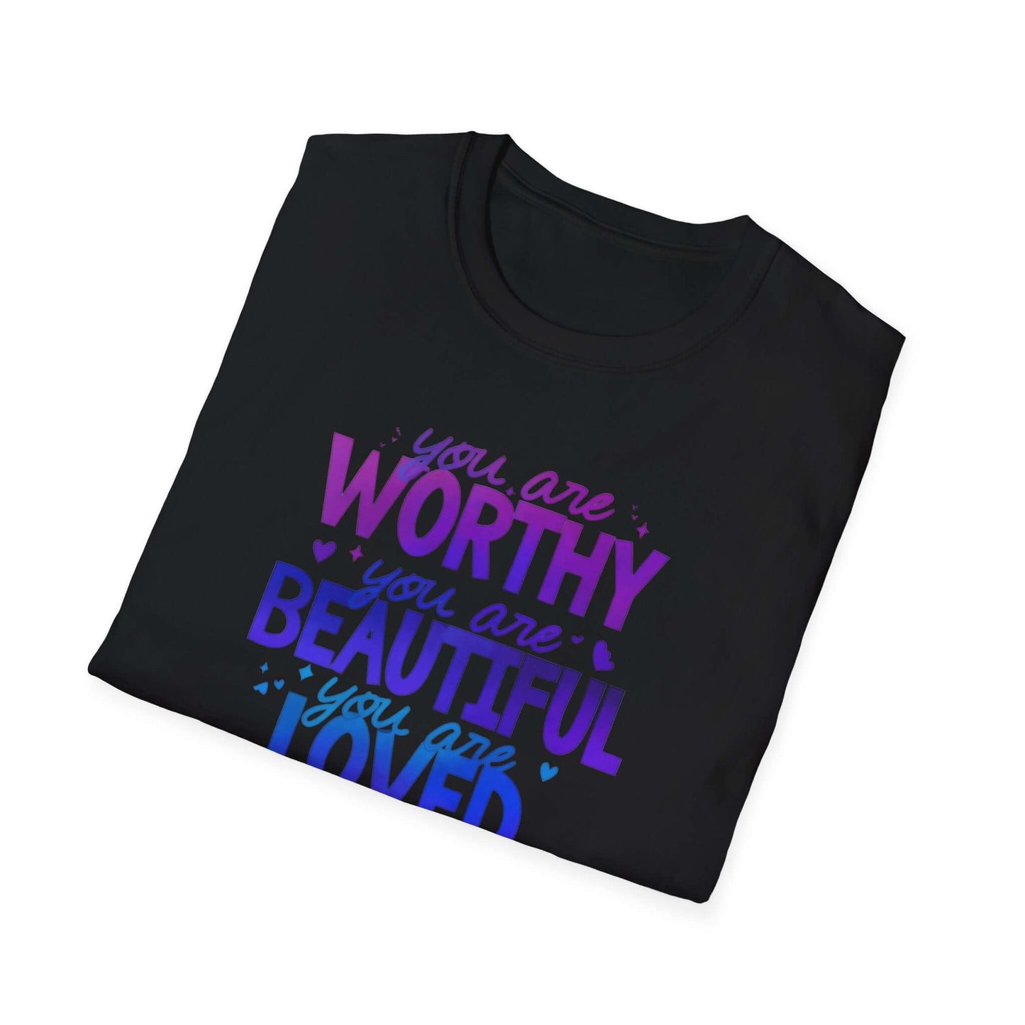 Black folded t-shirt featuring the text ‘You are Worthy, You are Beautiful, You are Loved, You are Enough’ in purple and blue font.