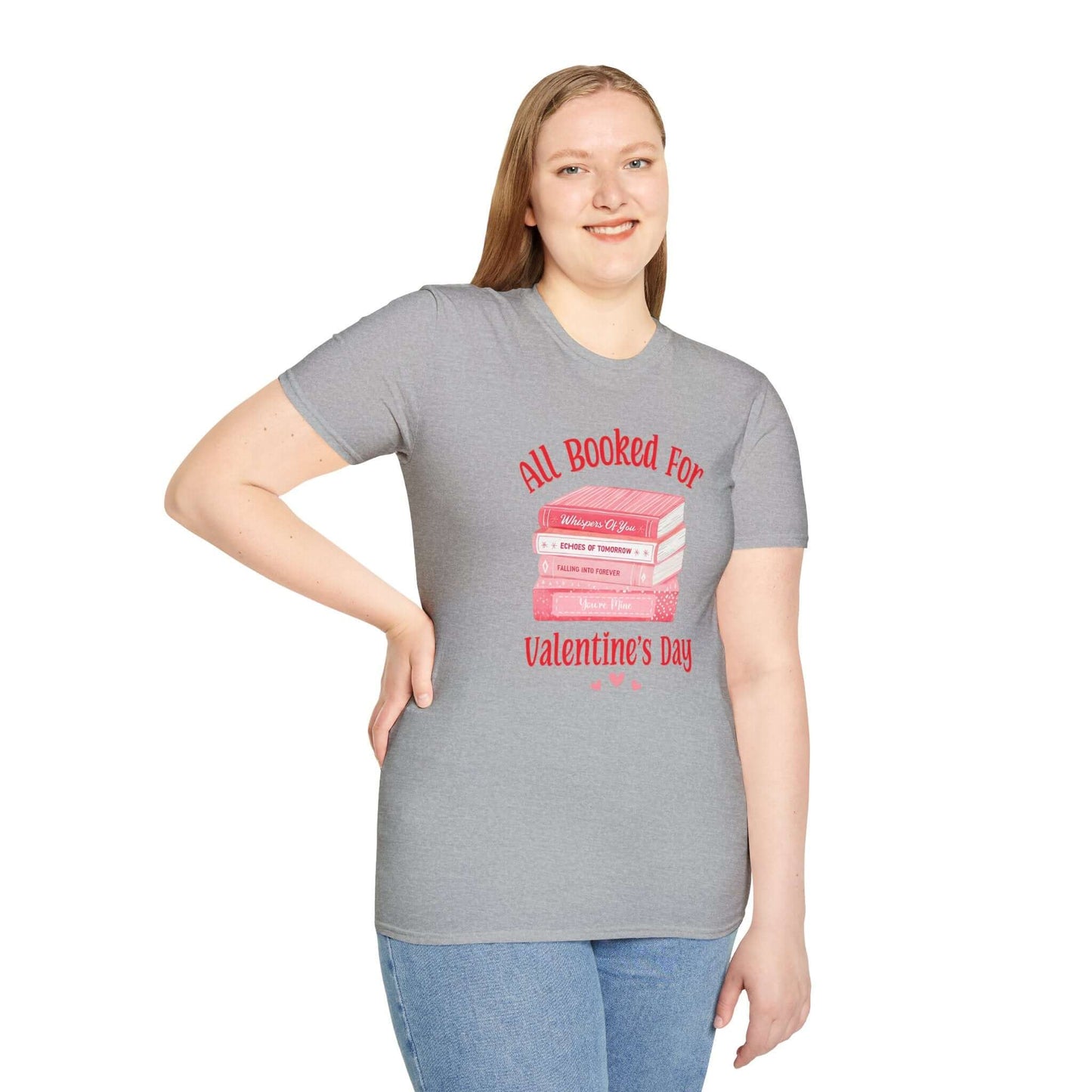 Woman wearing a gray t-shirt featuring the text ‘All Booked for Valentine’s Day’ with a graphic of stacked red and pink books.