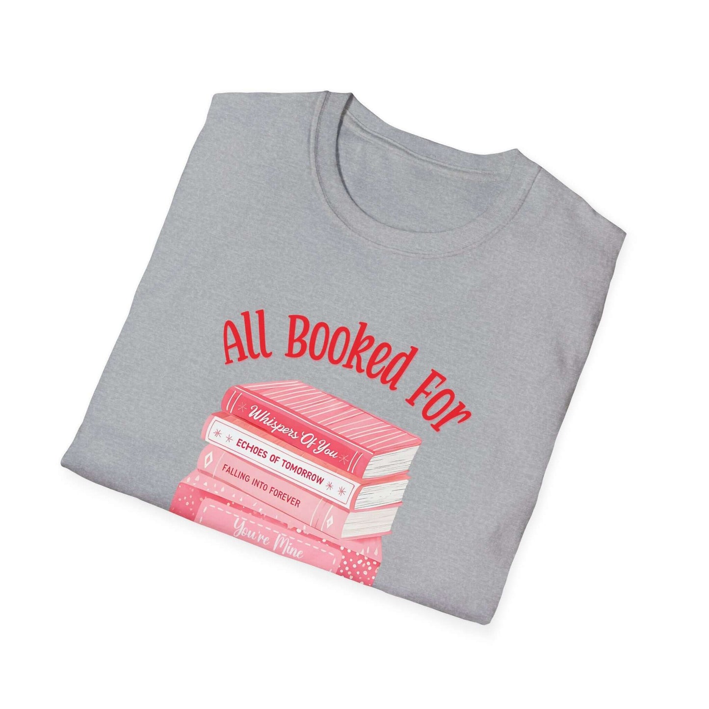 Gray folded t-shirt featuring the text ‘All Booked for Valentine’s Day’ with a graphic of stacked red and pink books.