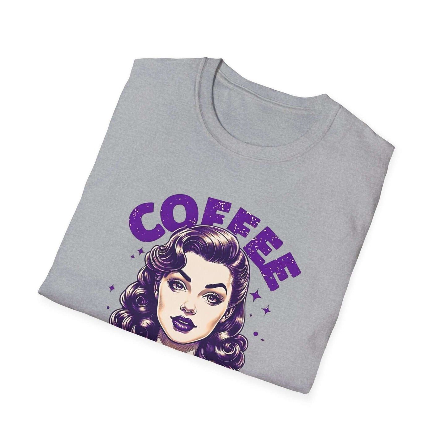 Folded gray unisex t-shirt with a retro ‘Coffee - Because Murder Is Wrong’ design in purple, featuring a vintage-style woman holding a coffee cup.