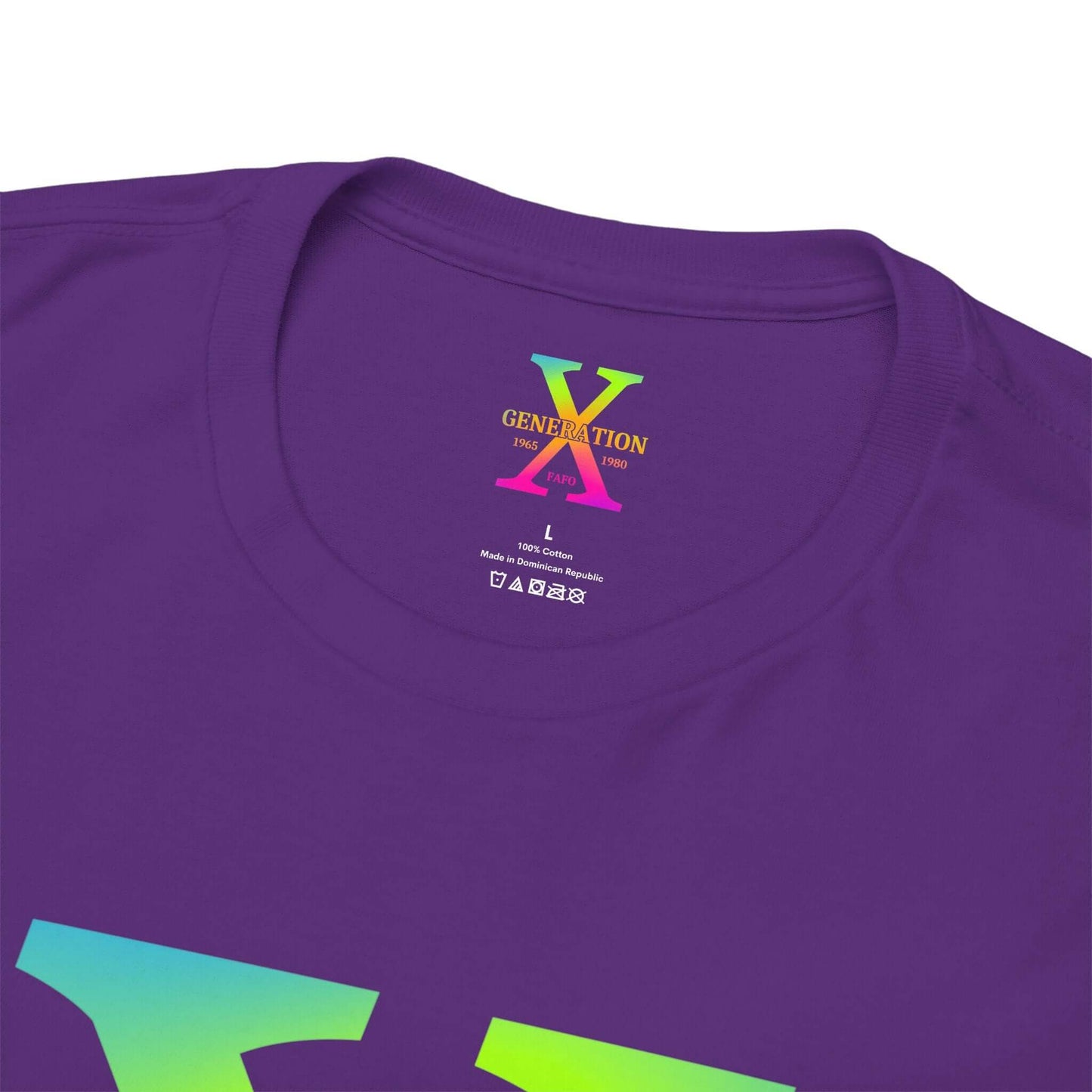 A purple t-shirt with a large rainbow gradient “X” on the front, representing Generation X. The inside collar features a printed label with the same “Generation X” design, size details, and care instructions.