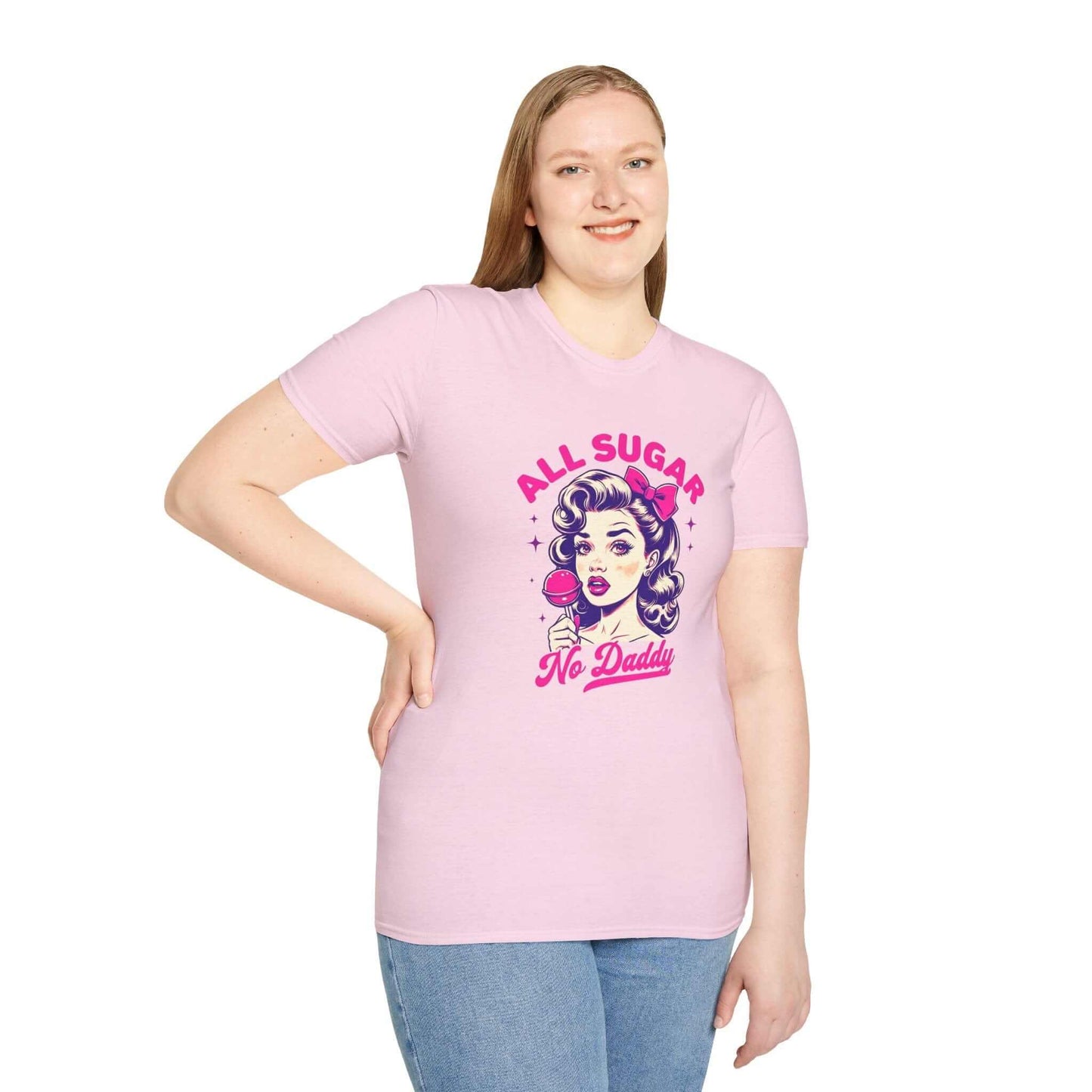 Smiling woman wearing a light pink unisex t-shirt featuring the bold ‘All Sugar, No Daddy’ retro-inspired design with vibrant colors.