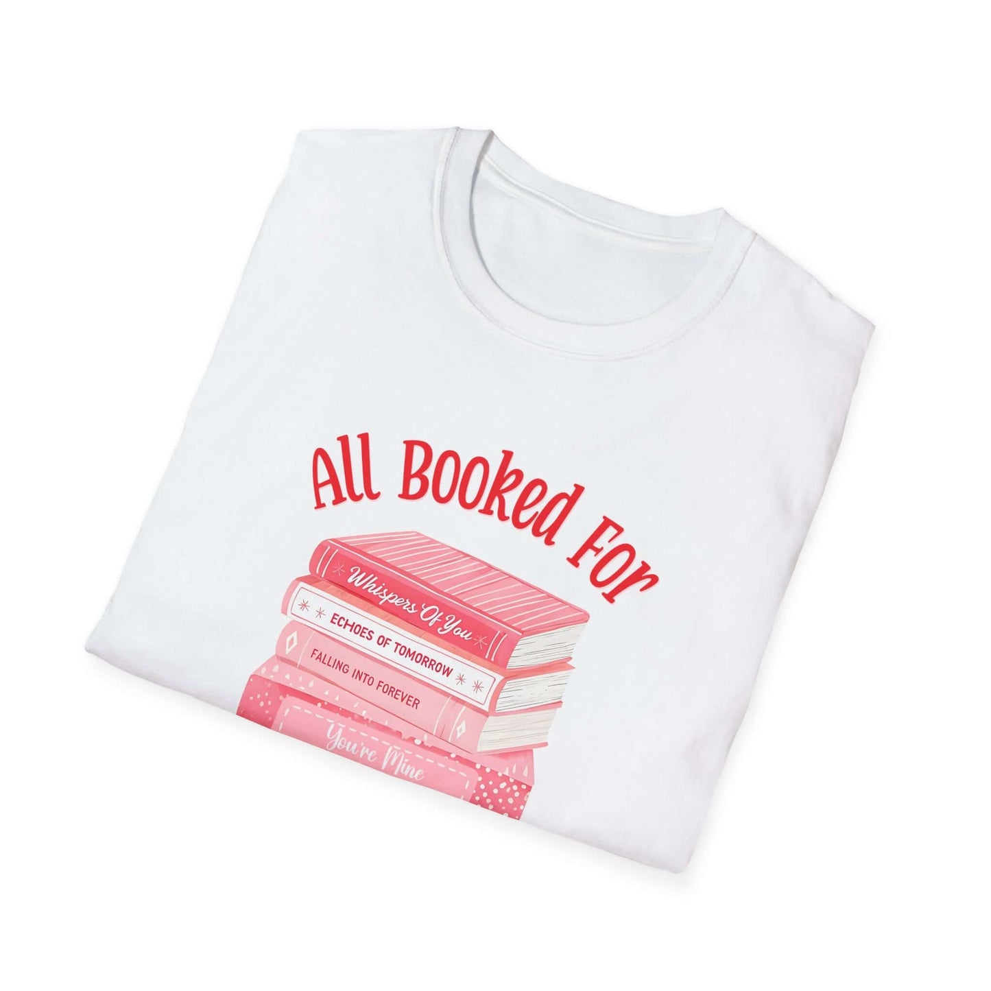 White folded t-shirt featuring the text ‘All Booked for Valentine’s Day’ with a graphic of stacked red and pink books.