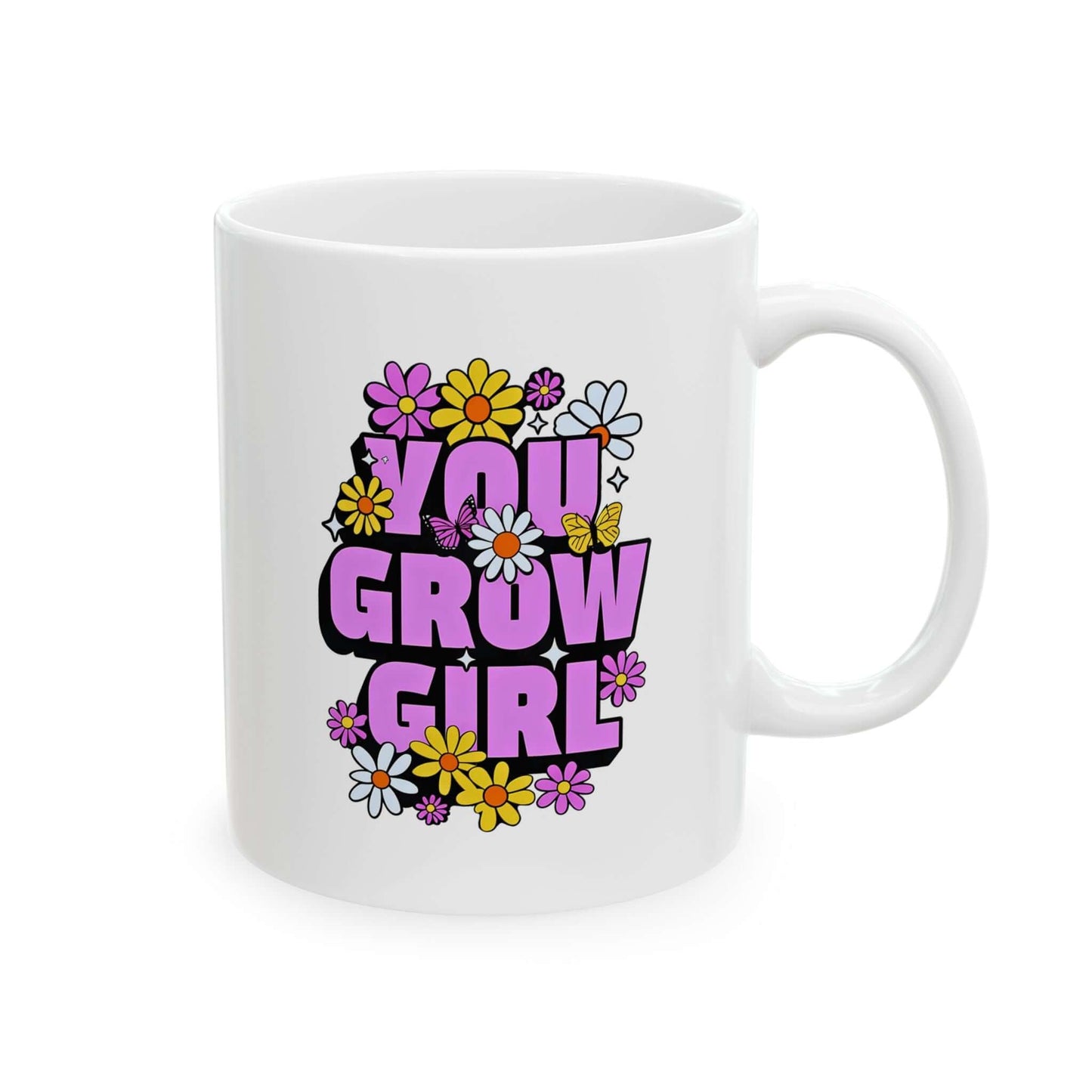 white ceramic mug featuring the text ‘YOU GROW GIRL’ in bold purple letters surrounded by colorful flowers.