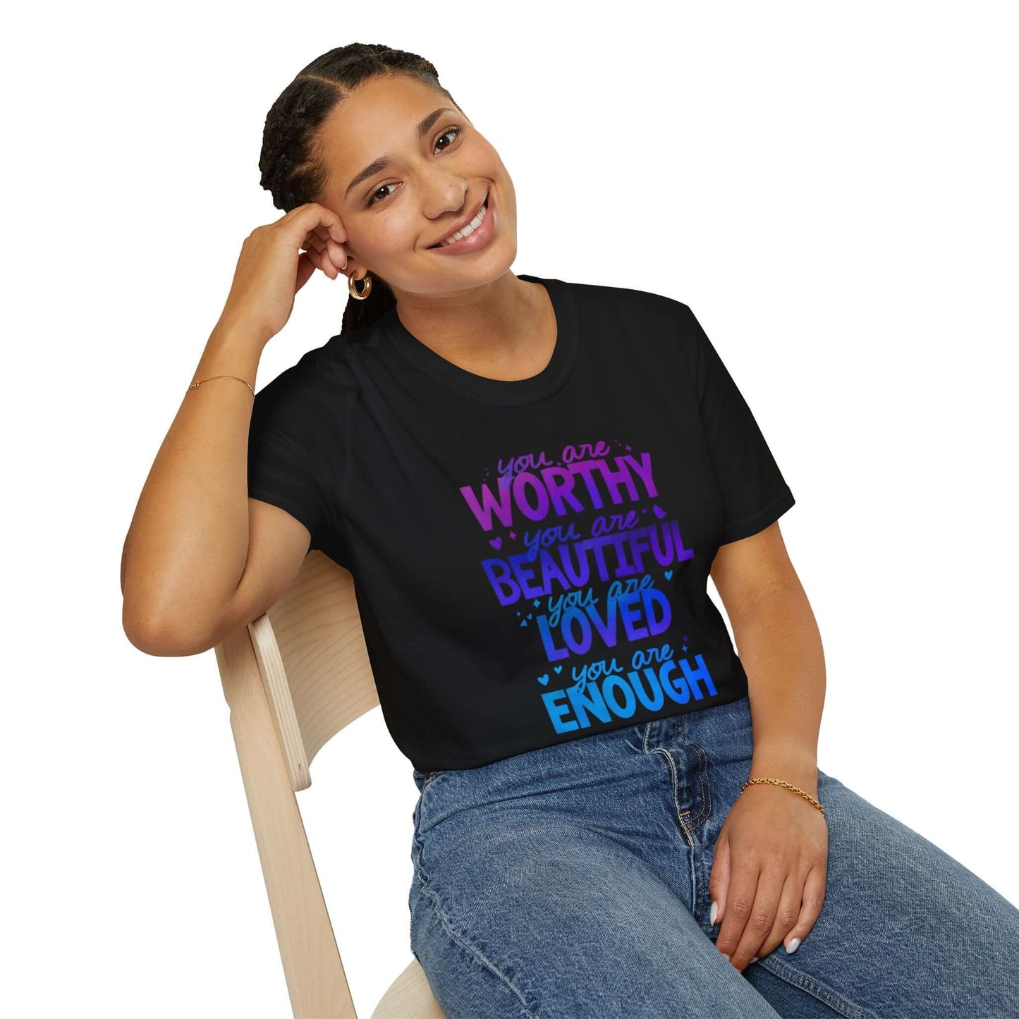 Black t-shirt featuring the text ‘You are Worthy, You are Beautiful, You are Loved, You are Enough’ in purple and blue font, worn by a smiling model.