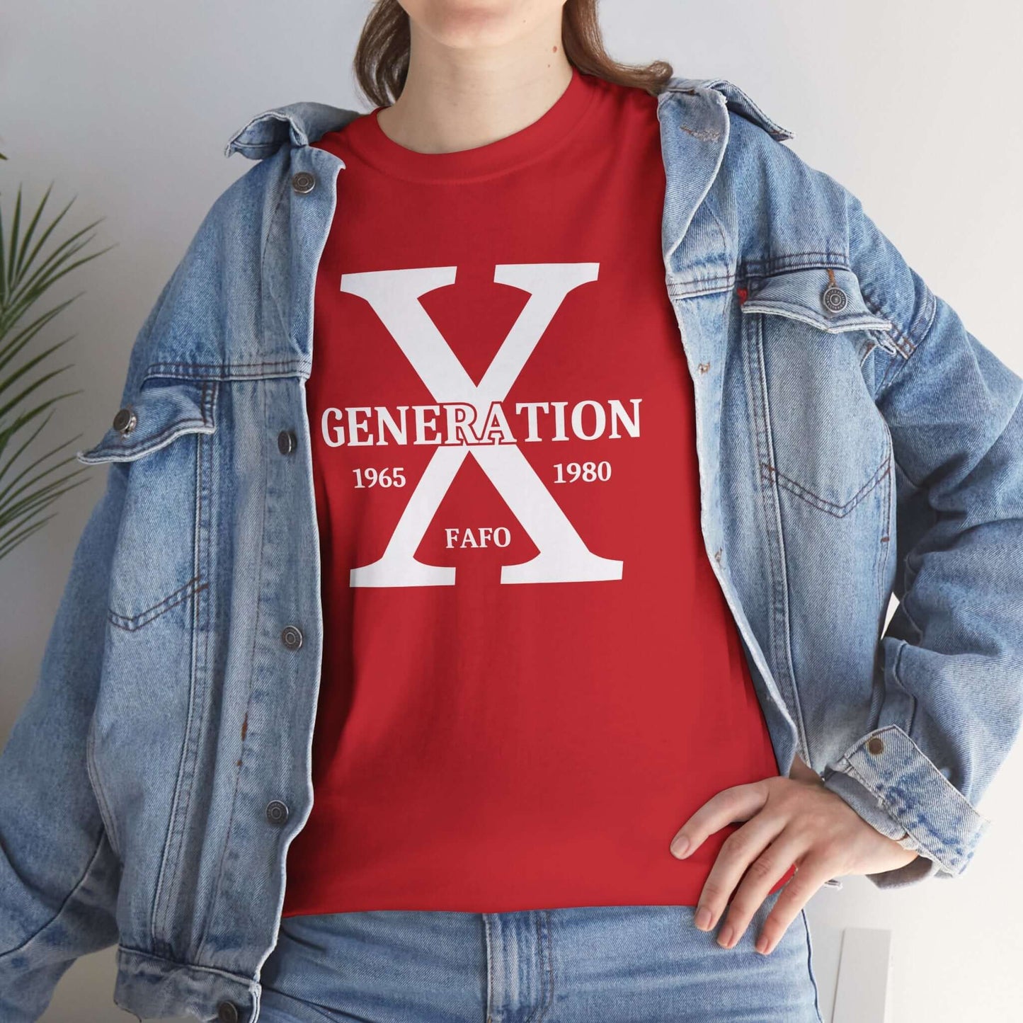 A person wearing a bold red “GENERATION X FAFO” t-shirt, styled with a light-wash denim jacket. The oversized “X” design stands out against the vibrant red fabric, creating a strong and confident statement.