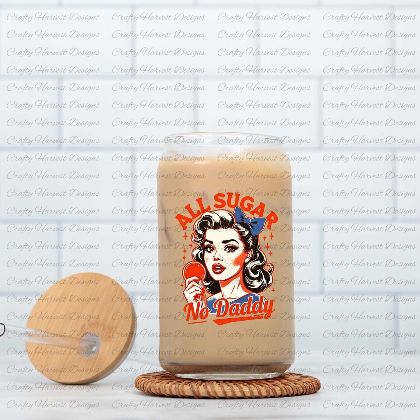 Clear glass can featuring a retro-inspired digital design of a vintage-style woman holding a lollipop, with the bold text ‘All Sugar No Daddy’ in red and blue. The glass can is displayed on a woven coaster alongside a matching wooden lid with a straw slot, highlighting its use as a stylish and functional drinkware item.