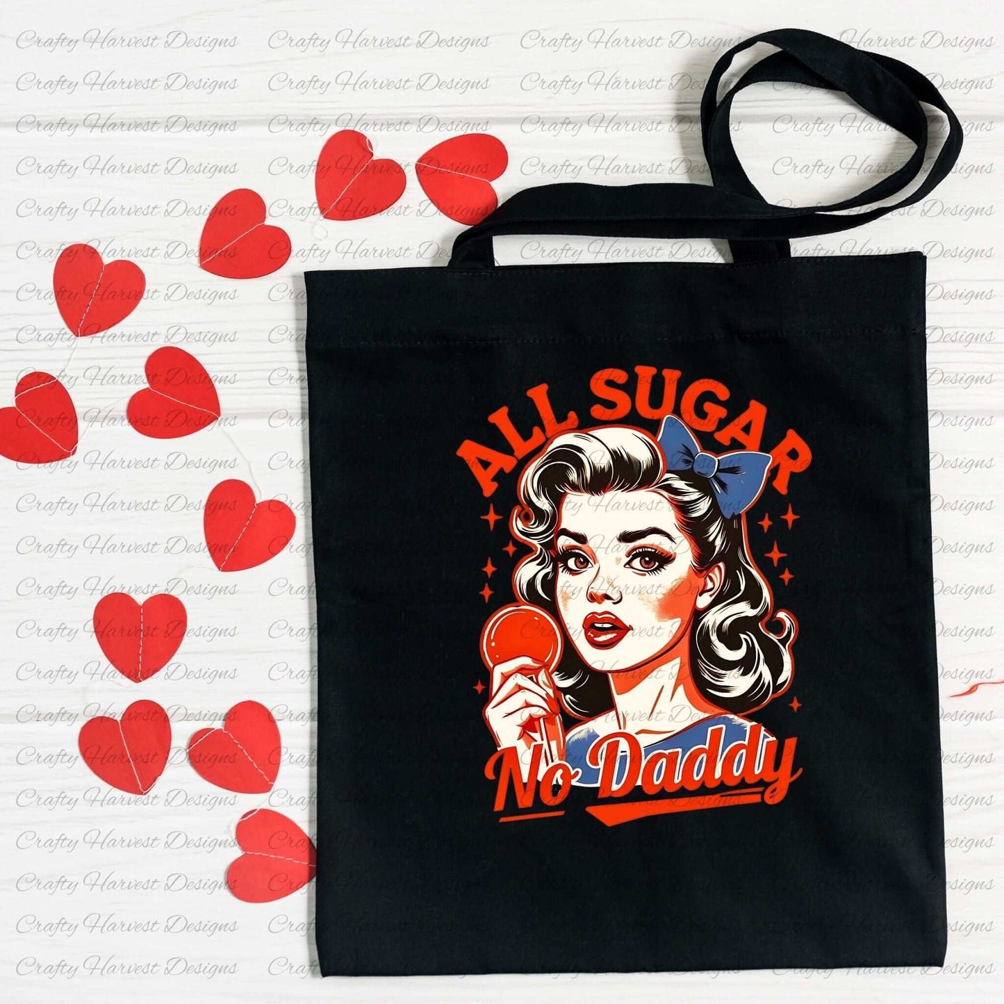 Black tote bag featuring a retro-inspired digital design of a vintage-style woman holding a lollipop, with the bold text ‘All Sugar No Daddy’ in red and blue accents. The bag is displayed on a flat surface surrounded by scattered red heart cutouts, highlighting its use as a stylish and practical accessory.