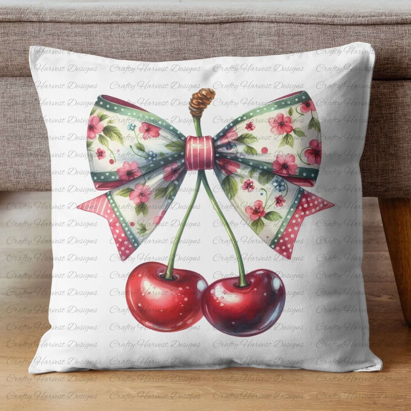 a pillow featuring a floral cherry design with a large bow. The bow has a vintage-inspired pattern with pink flowers, green accents, and polka dot trim. The cherries have a glossy red appearance with detailed stems