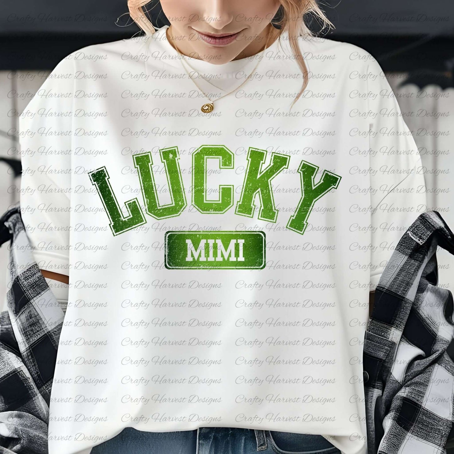 Close-up of a woman wearing a white t-shirt with the ‘Lucky Mimi’ St. Patrick’s Day design in bold green text. She is accessorized with a gold necklace and has a plaid shirt draped over her shoulders.