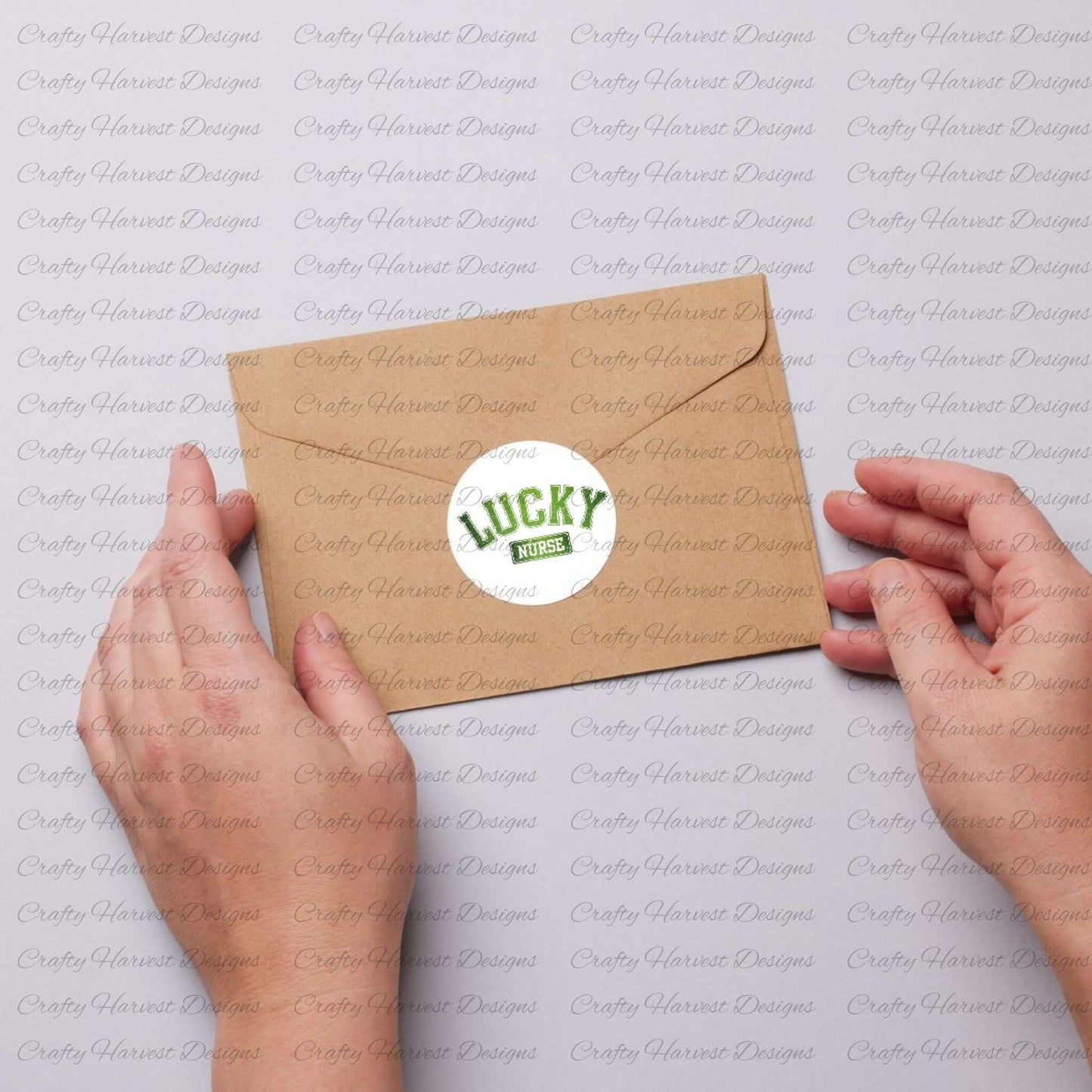 Two hands holding a kraft envelope sealed with a circular sticker featuring the ‘Lucky Nurse’ St. Patrick’s Day design in bold green text on a white background.
