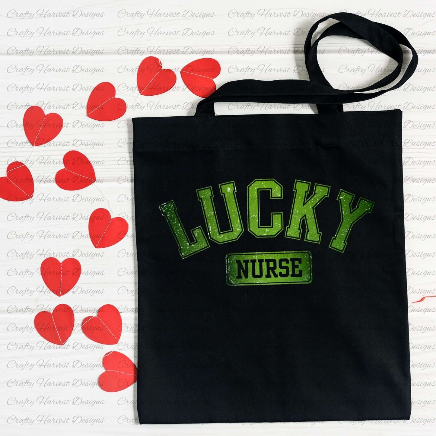 Black tote bag featuring the ‘Lucky Nurse’ St. Patrick’s Day design in bold green text. The bag is displayed on a white surface decorated with red heart-shaped cutouts.