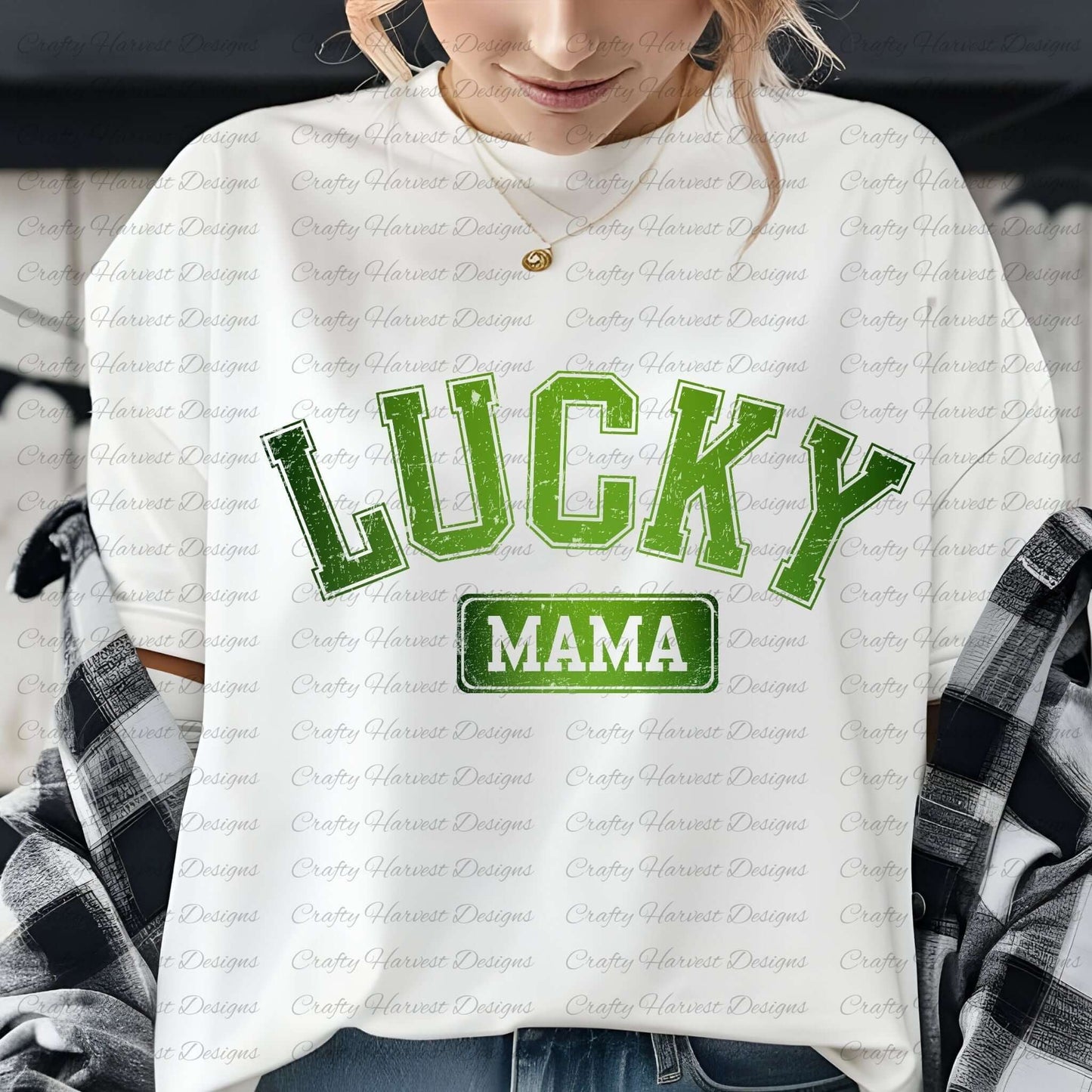 Close-up of a woman wearing a white t-shirt featuring the design ‘Lucky Mama’ in bold green text with a St. Patrick’s Day theme. She is also wearing a plaid shirt draped over her shoulders and a gold necklace.