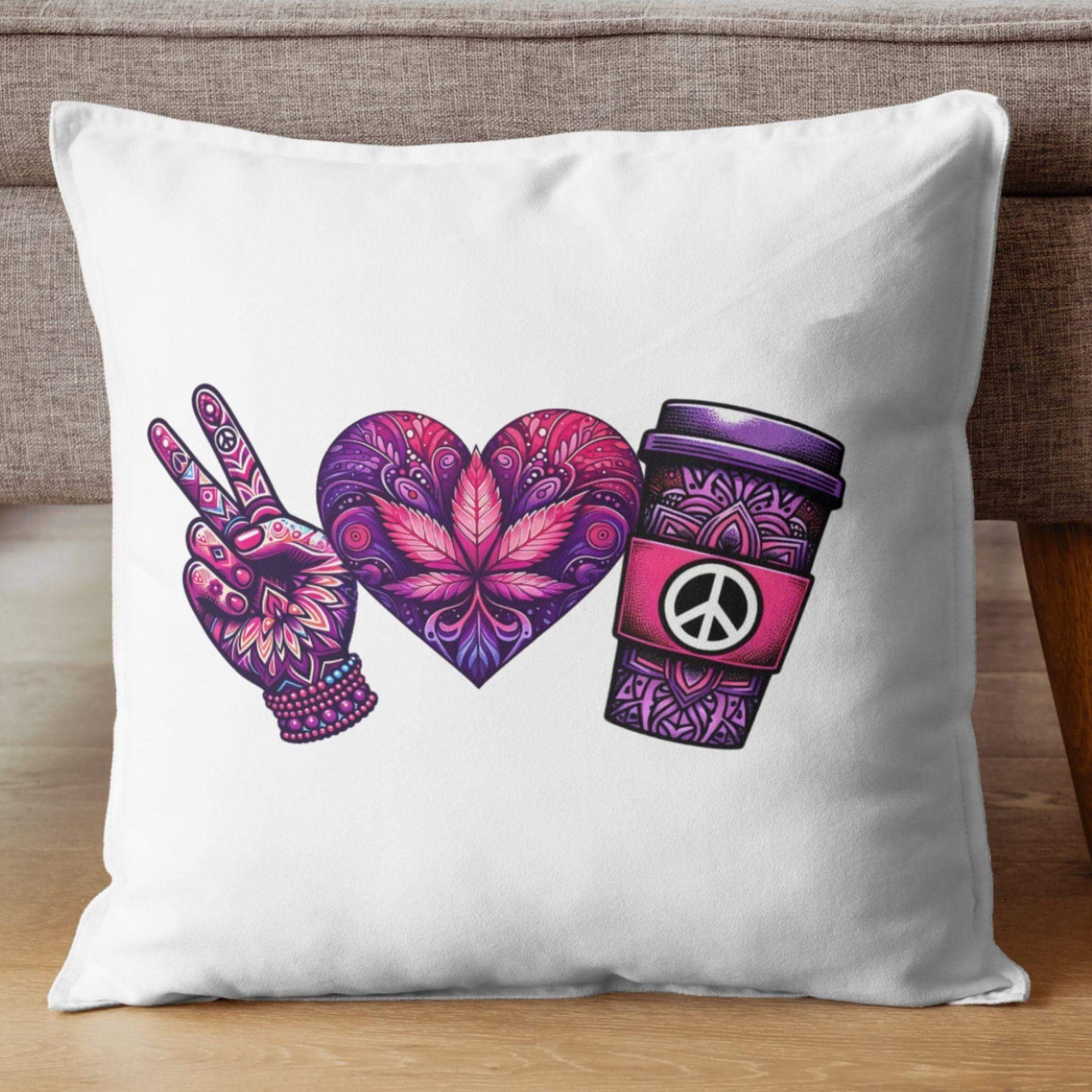 White throw pillow featuring a peace-themed design in vibrant purple and pink tones. Includes a peace sign hand, a heart with intricate floral patterns, and a coffee cup with a peace symbol, displayed on a light background.