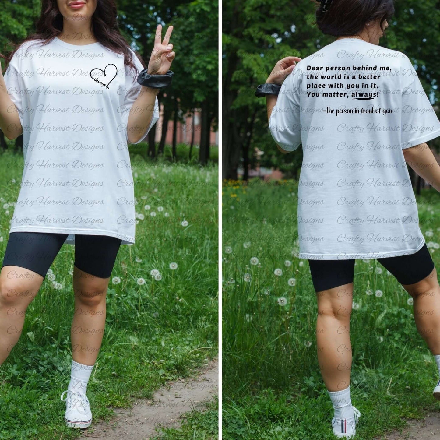 Model wearing a white t-shirt featuring the “Dear person behind me” design. The front displays a heart with the word “always” on the left chest pocket area. The back shows the quote: “Dear person behind me, the world is a better place with you in it! You matter, always! –the person in front of you” in black text. The model poses outdoors in a grassy area with trees, making a peace sign with her hand.