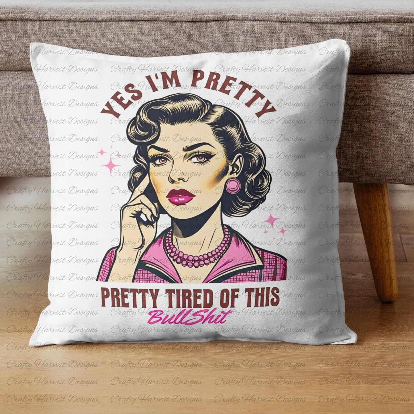 White throw pillow featuring a retro-inspired digital design of a vintage-style woman with the humorous text ‘Yes I’m Pretty - Pretty Tired of This Bullsh*t’ in pink and brown colors. The pillow is displayed on a wooden floor beside a sofa, showcasing its use as a decorative home decor item.