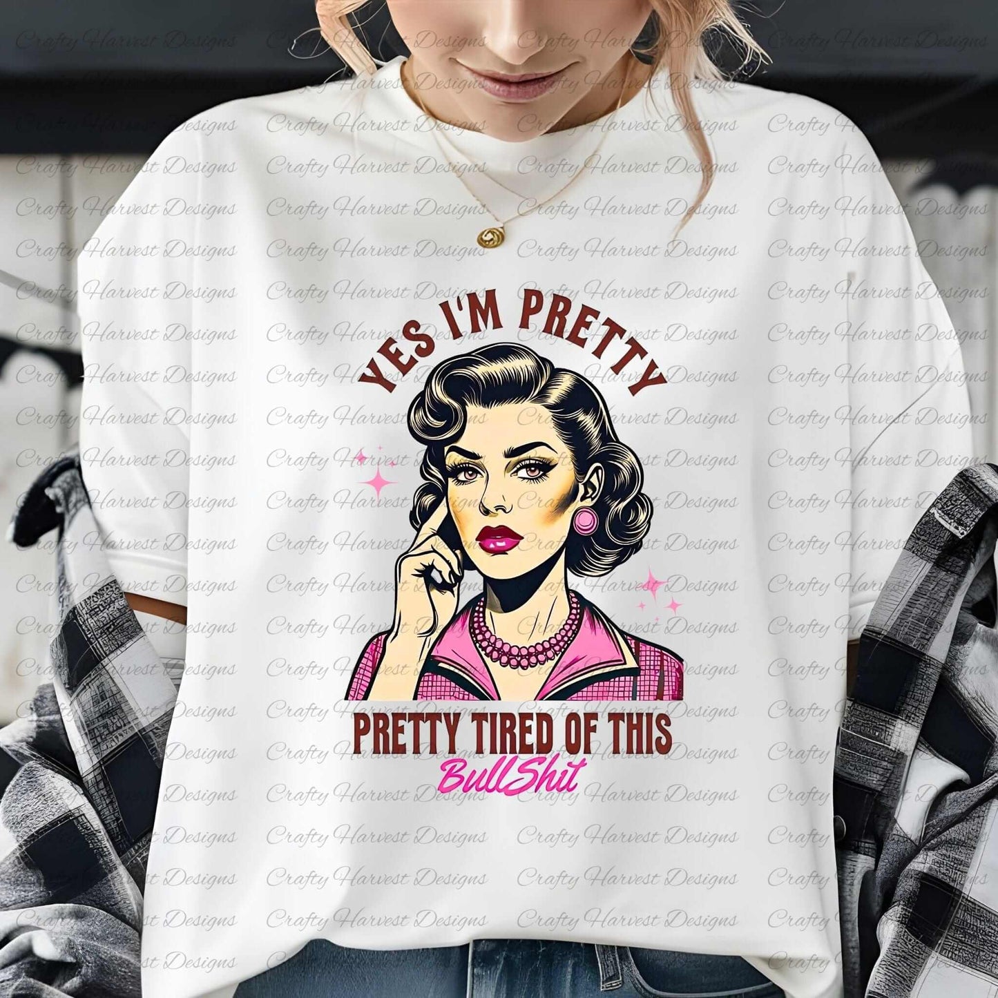 White t-shirt featuring a retro-inspired digital design of a vintage-style woman with the humorous text ‘Yes I’m Pretty - Pretty Tired of This Bullsh*t’ in pink and brown colors. The t-shirt is styled on a person wearing a necklace, showcasing its use as a witty and stylish apparel option.