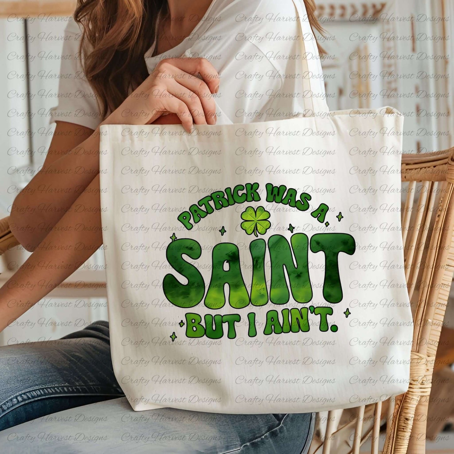 Person holding a cream-colored tote bag featuring the St. Patrick’s Day phrase ‘Patrick Was a Saint, But I Ain’t’ in bold green lettering with a shamrock accent. The mockup highlights how the design looks on fabric accessories. PNG and PDF download available.