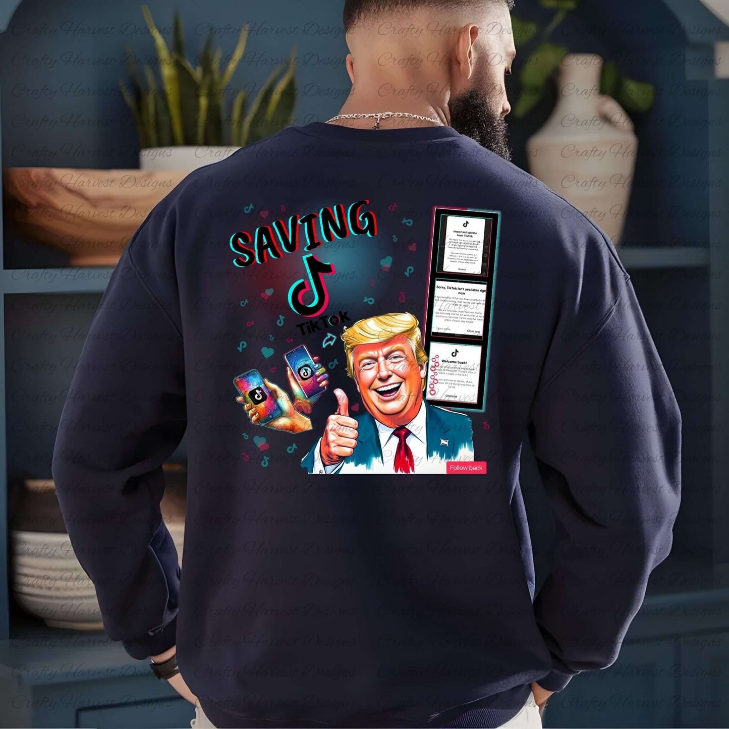 Back view of a navy sweatshirt featuring the ‘Saving TikTok’ digital design with bold text in TikTok-inspired colors, playful icons, hearts, and a humorous caricature of Donald Trump, capturing the TikTok reinstatement theme. Ideal for custom apparel and parody enthusiasts.