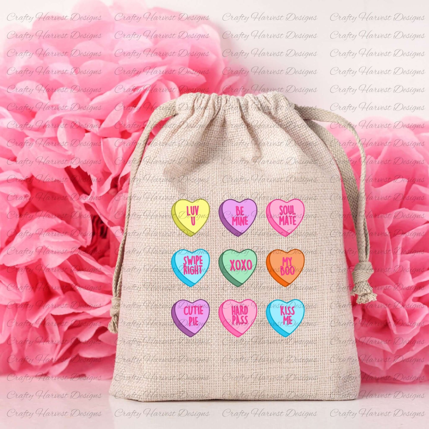 Mockup of a beige drawstring bag featuring the traditional Valentine’s conversation heart design. The bag displays colorful hearts with sweet phrases like “Luv U,” “Be Mine,” “Soul Mate,” “Swipe Right,” “XOXO,” “My Boo,” “Cutie Pie,” “Hard Pass,” and “Kiss Me.” The background includes soft pink tissue paper, creating a romantic and festive vibe. Perfect for Valentine’s gift bags or DIY projects.