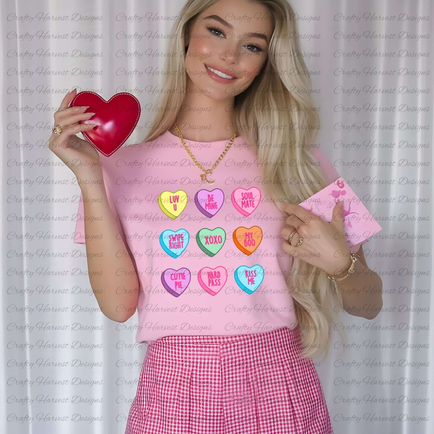 Mockup of a woman wearing a pink t-shirt featuring the traditional Valentine’s conversation heart design. The shirt displays colorful hearts with sweet phrases like “Luv U,” “Be Mine,” “Soul Mate,” “Swipe Right,” “XOXO,” “My Boo,” “Cutie Pie,” “Hard Pass,” and “Kiss Me.” The woman is holding a red heart-shaped box and a pink Valentine’s card, styled for a festive and cheerful Valentine’s Day look.