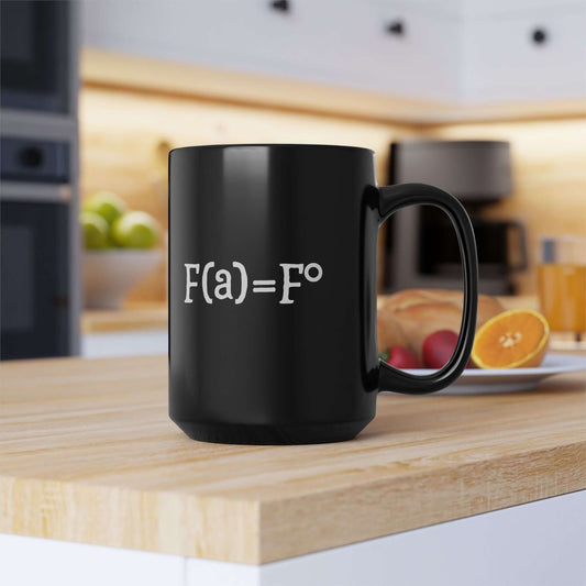 A black ceramic coffee mug featuring the witty “FAFO equation” design in white text. The mug sits on a wooden kitchen countertop with a blurred background of a modern kitchen, including a coffee maker and fresh fruit, creating a cozy and stylish morning vibe.