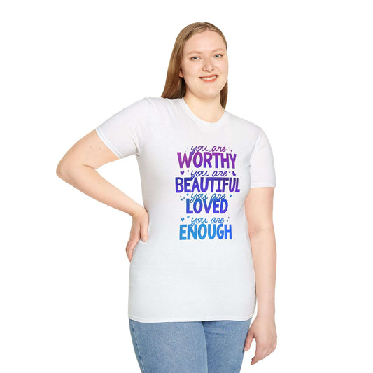 white t-shirt featuring the text ‘You are Worthy, You are Beautiful, You are Loved, You are Enough’ in purple and blue font, worn by a smiling model.