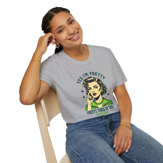 Smiling woman wearing a gray unisex t-shirt featuring a retro-style design with the text ‘Yes, I’m Pretty Tired of This Bullsh*t’ in green.