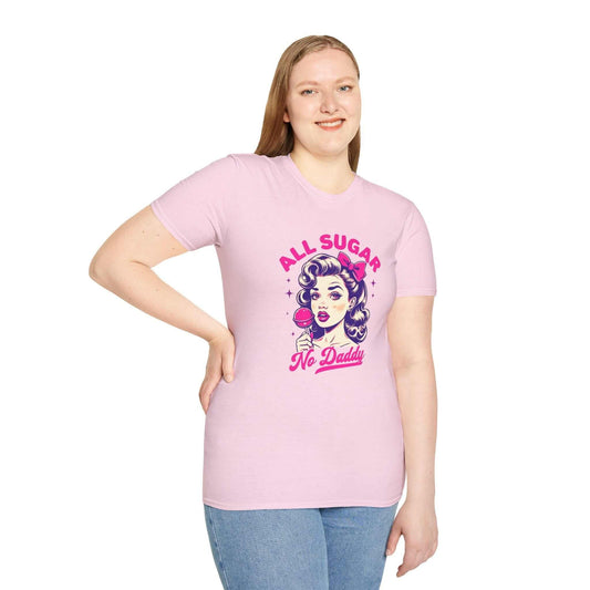 Smiling woman wearing a light pink unisex t-shirt featuring the bold ‘All Sugar, No Daddy’ retro-inspired design with vibrant colors.