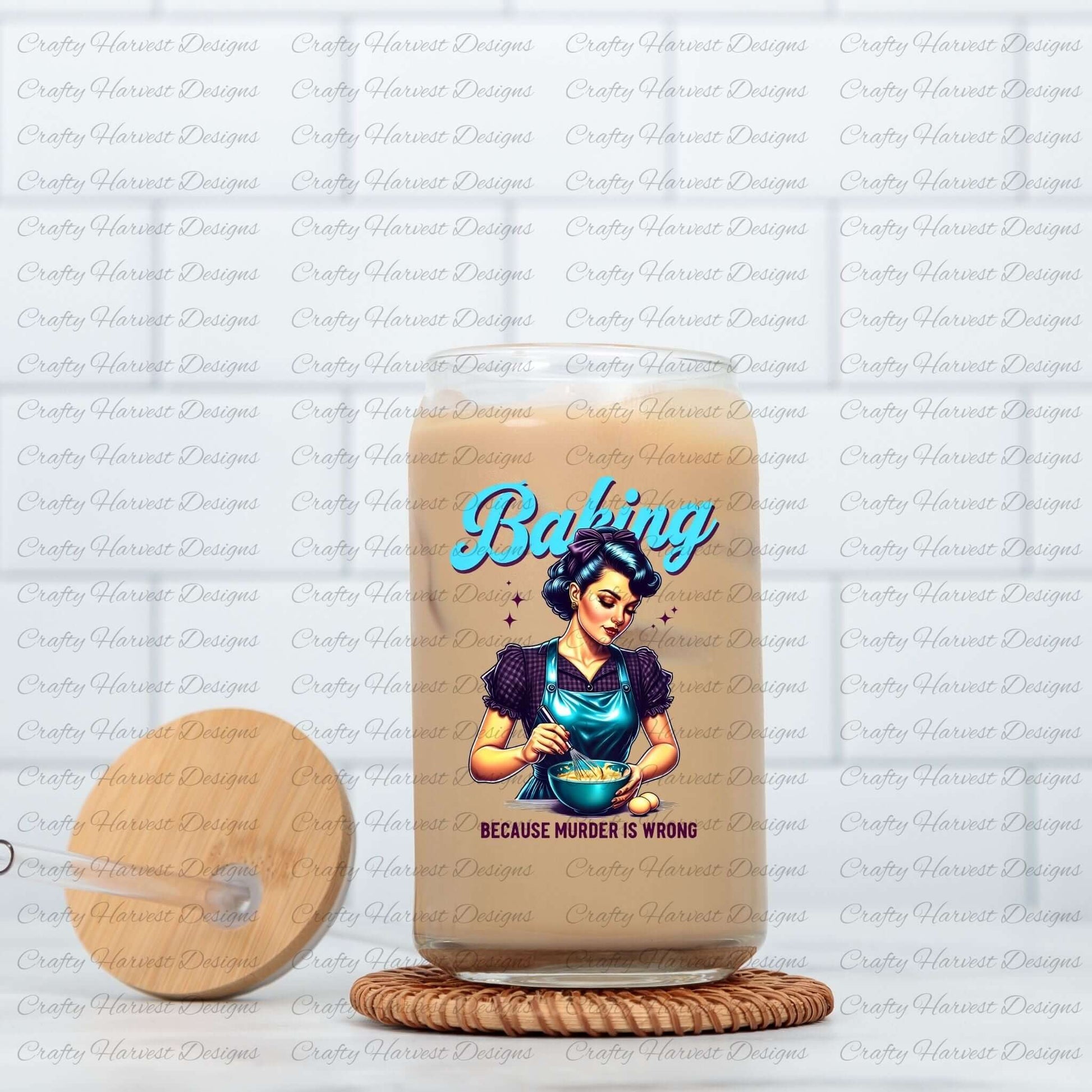 Glass jar with a bamboo lid and straw, featuring a retro baking design with the phrase ‘Because Murder is Wrong,’ placed on a woven coaster.