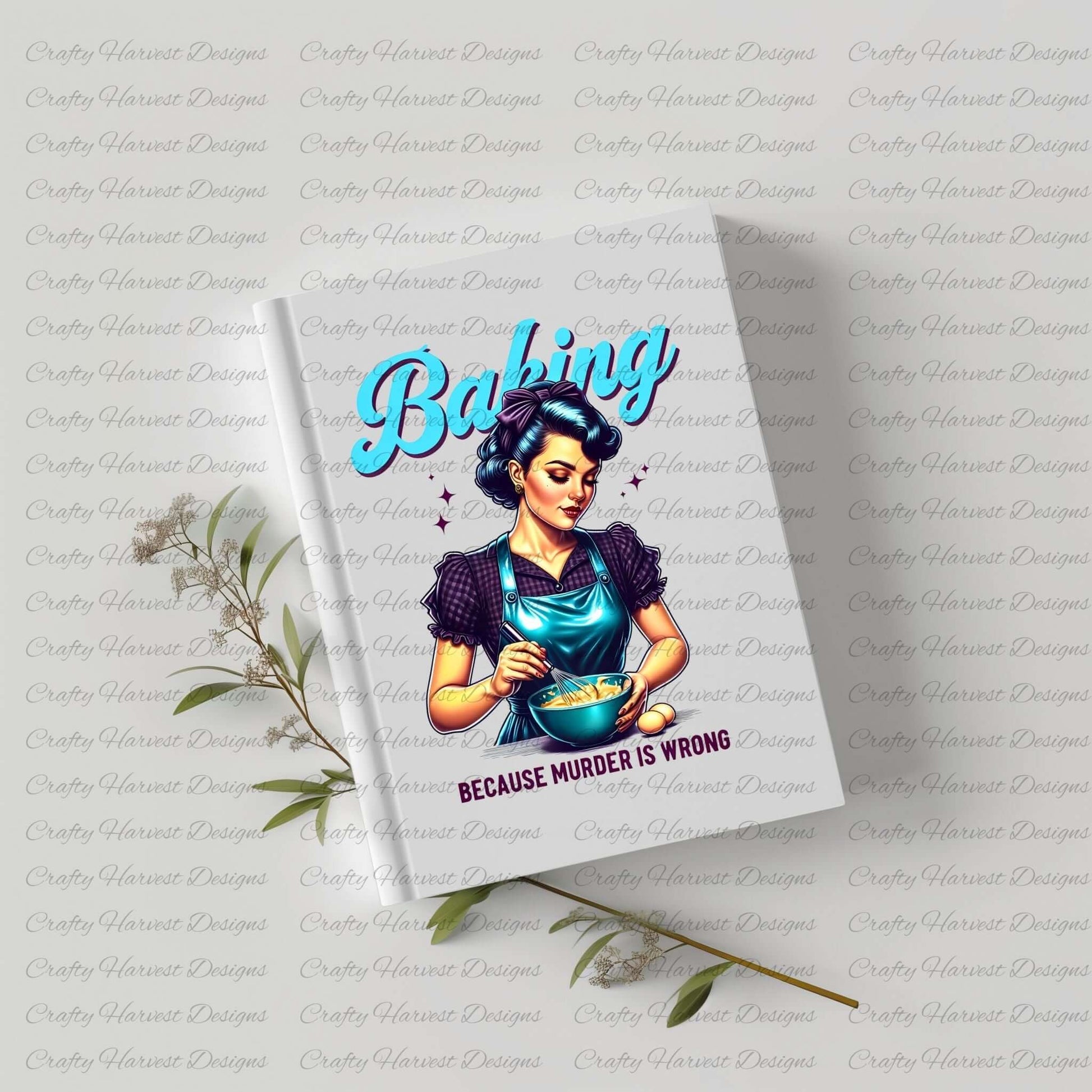Notebook featuring a retro-style baking design with the phrase ‘Because Murder is Wrong,’ displayed on a white cover with a sprig of greenery beside it.