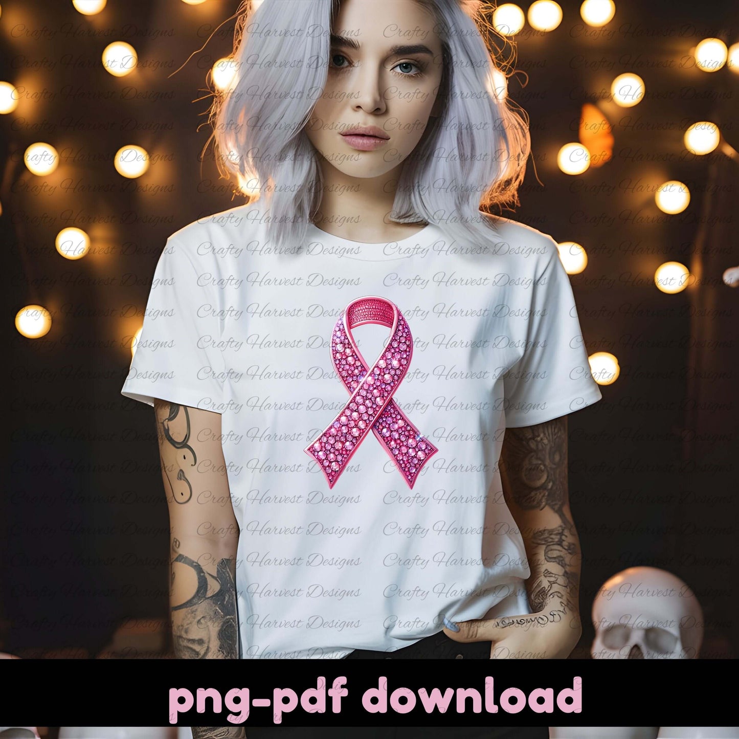 Person wearing a white t-shirt with a pink ribbon design against a blurred background with lights.