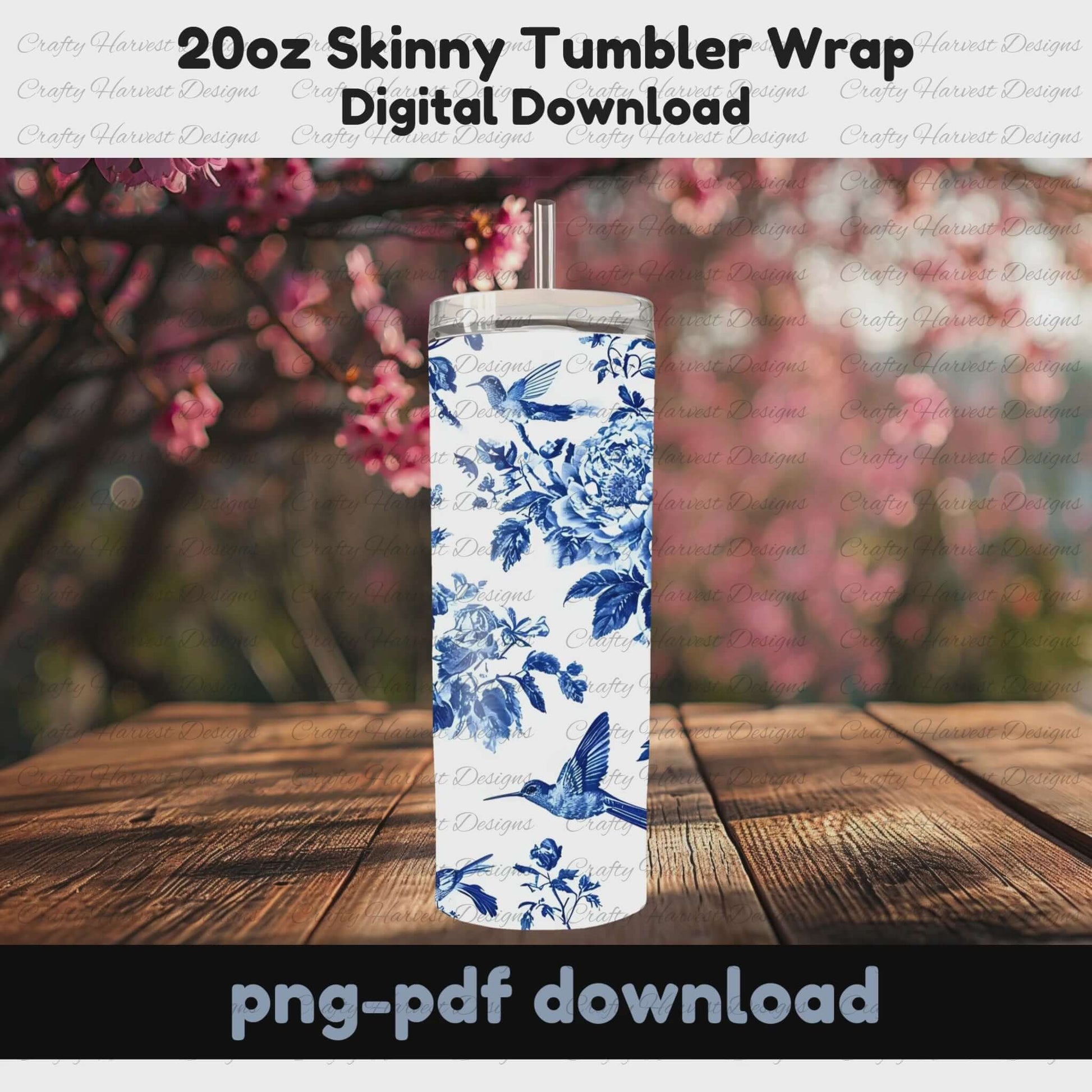 This rotating mockup showcases the blue and white floral tumbler wrap, featuring intricate peonies and hummingbirds, on a 20oz skinny tumbler. The tumbler is displayed outdoors on a wooden surface with pink blossoms in the background, emphasizing its elegant design.