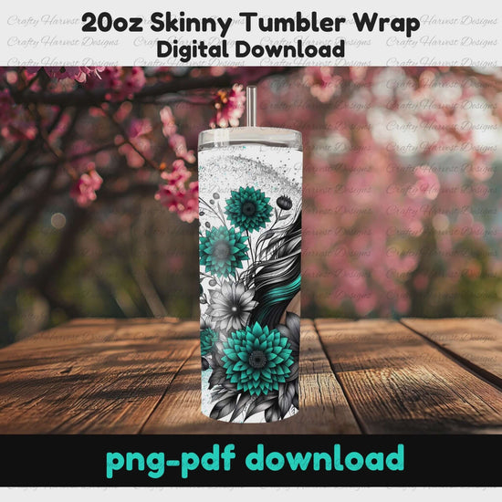 A 20oz skinny tumbler wrap featuring a striking black-and-teal floral design with a woman’s flowing hair woven into the artwork. The tumbler is displayed outdoors on a rustic wooden surface with cherry blossoms in the background. This digital download is available in PNG and PDF formats, perfect for sublimation projects.